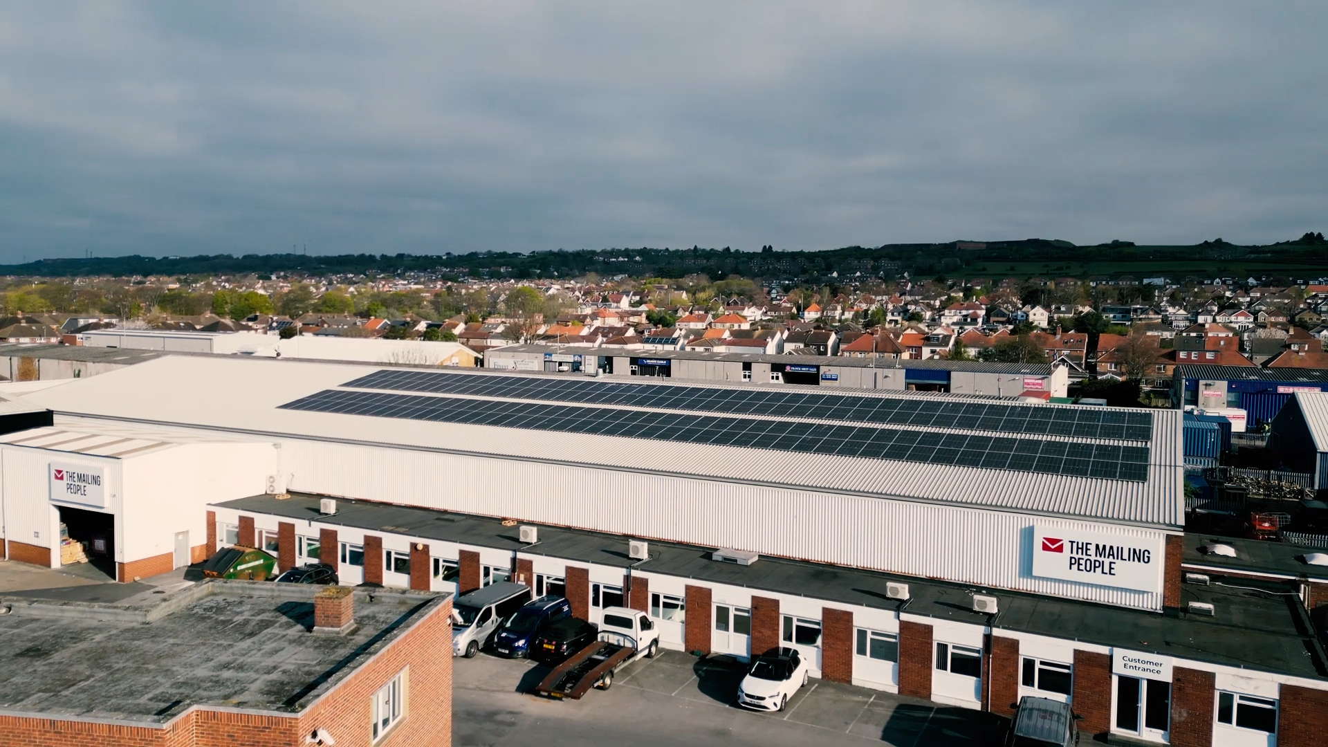 A photo showing the building of The Mailing People, showing the solar panels on their roof.